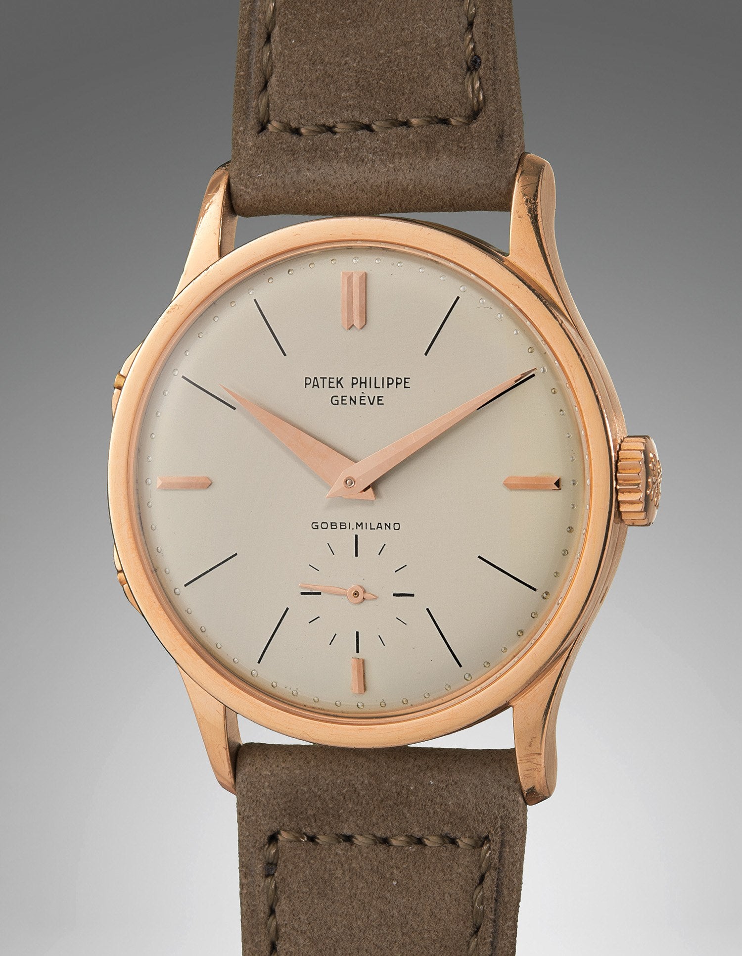 Patek Philippe reference 2597 in pink gold, 1959: a plain silvered dial with a single hour hand, and two pushers in the left side of the case